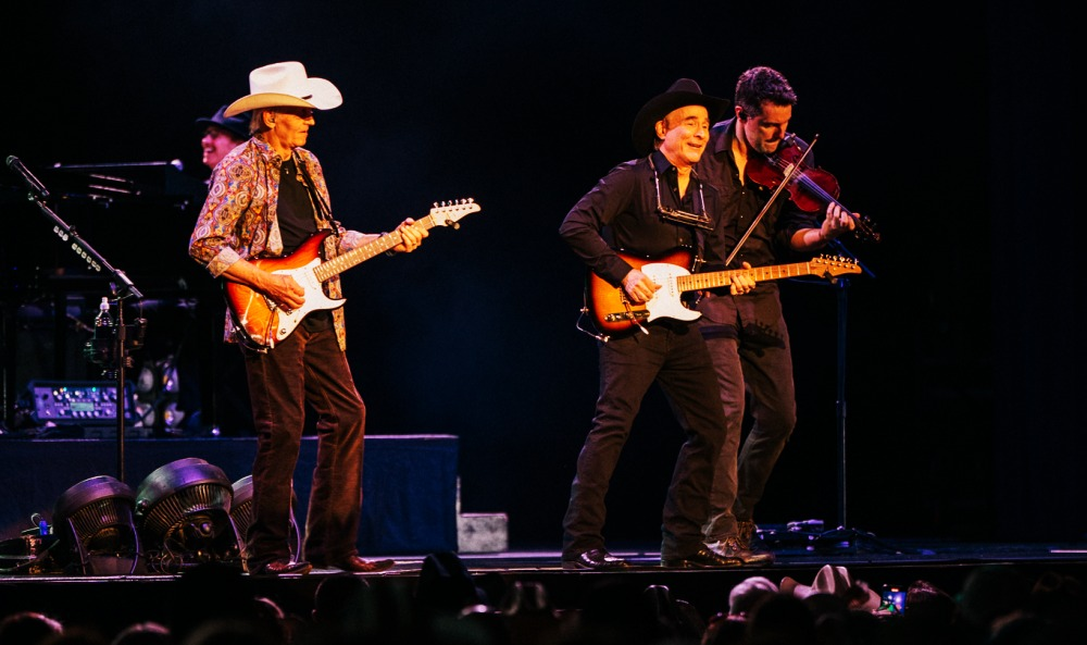 Clint Black performs on stage.