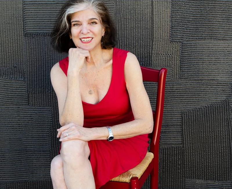 Marcia Ball sitting in a red chair