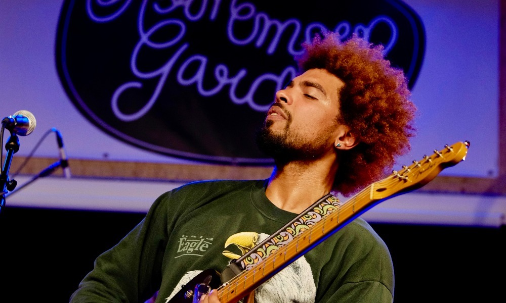 Devon Gilfillian soul singer performing live on stage