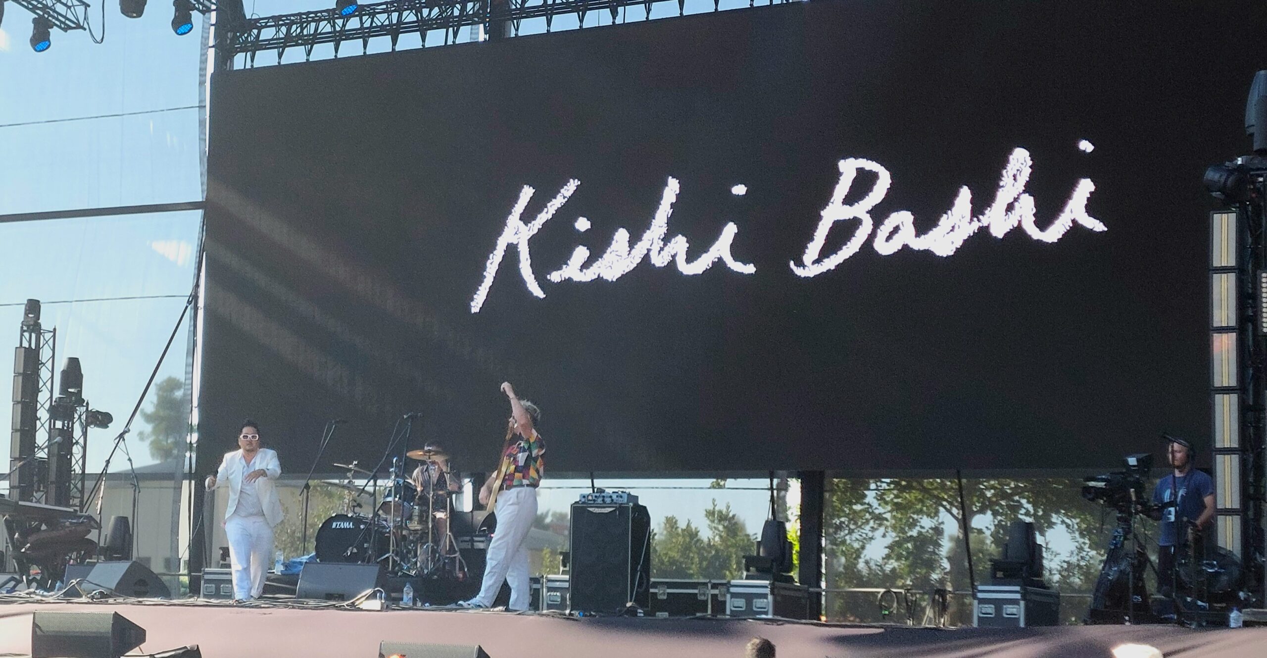 Kishi Bashi performing with violin on stage