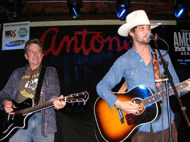 Ryan Bingham playing acoustic guitar on stage in 2008